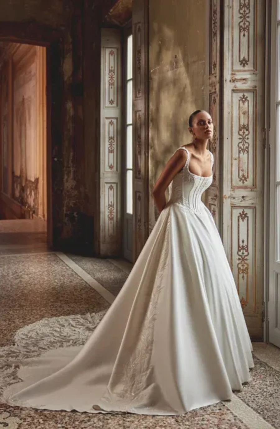 model is wearing a sleeveless ball gown