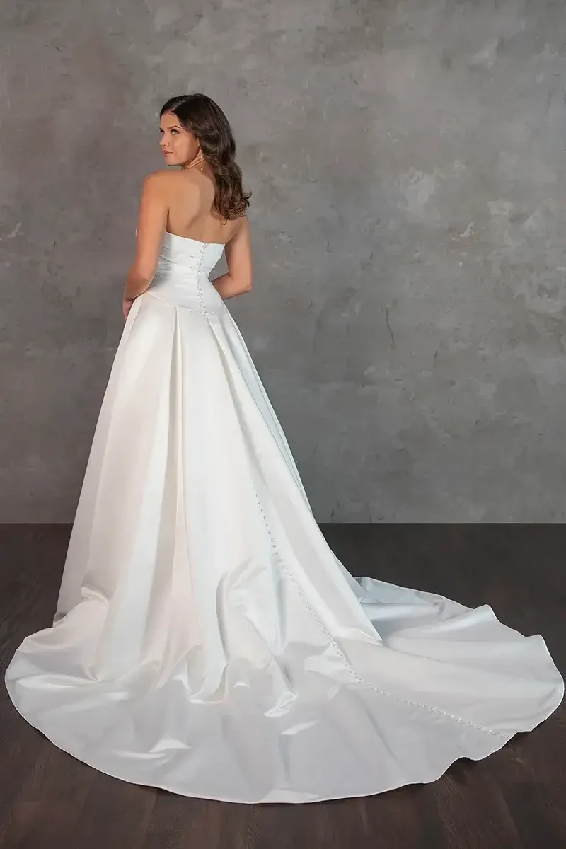 model is wearing a strapless a-line bridal gown