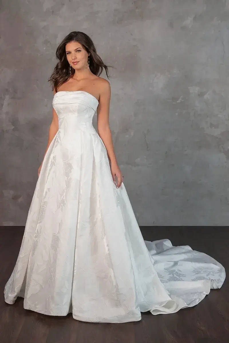 model is wearing a strapless a-line bridal gown