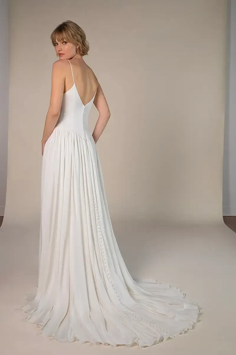 model is wearing a sleeveless a-line wedding dress