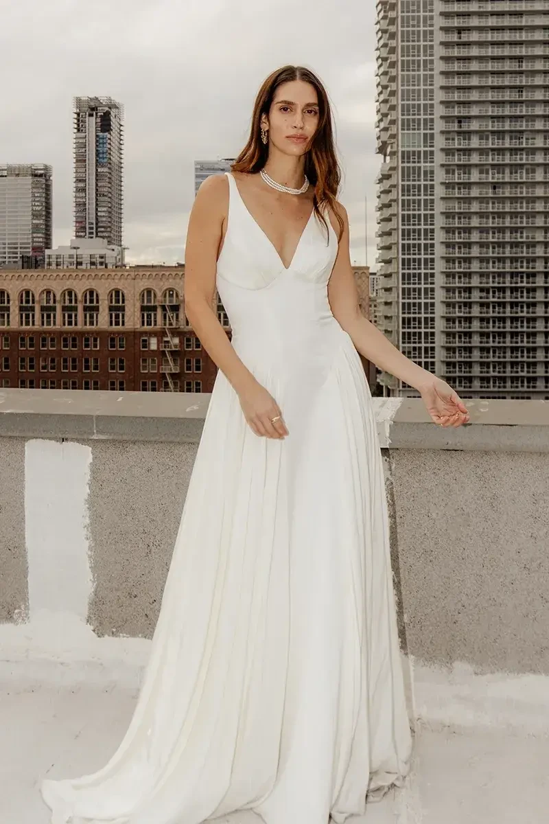 model is wearing a sleeveless a-line wedding dress