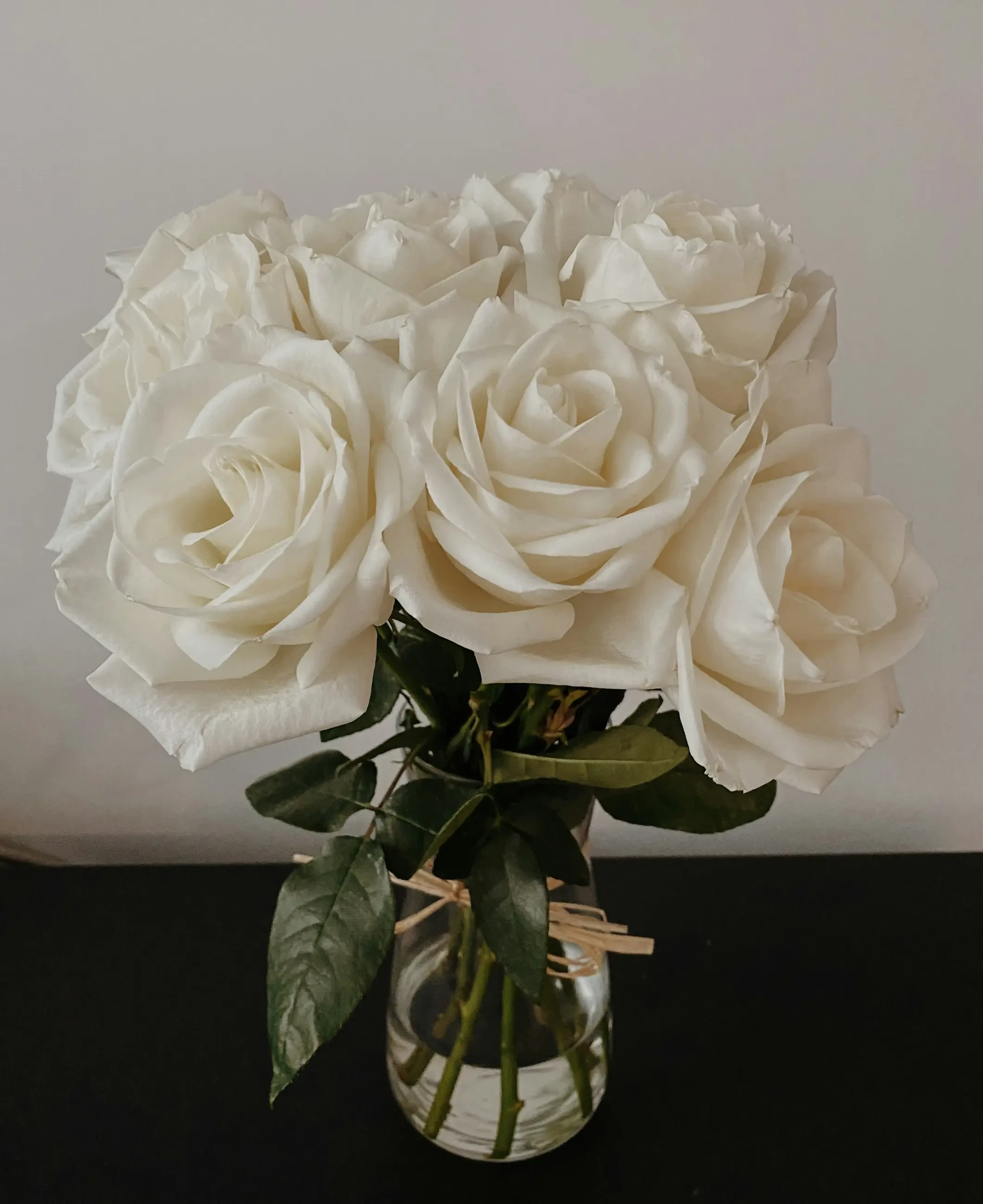 image shows a bouquet of white roses
