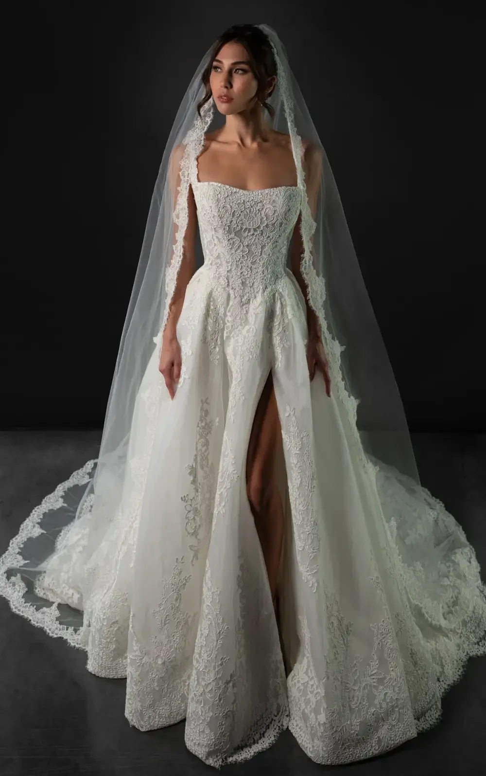 model is wearing a lace basque waist wedding dress